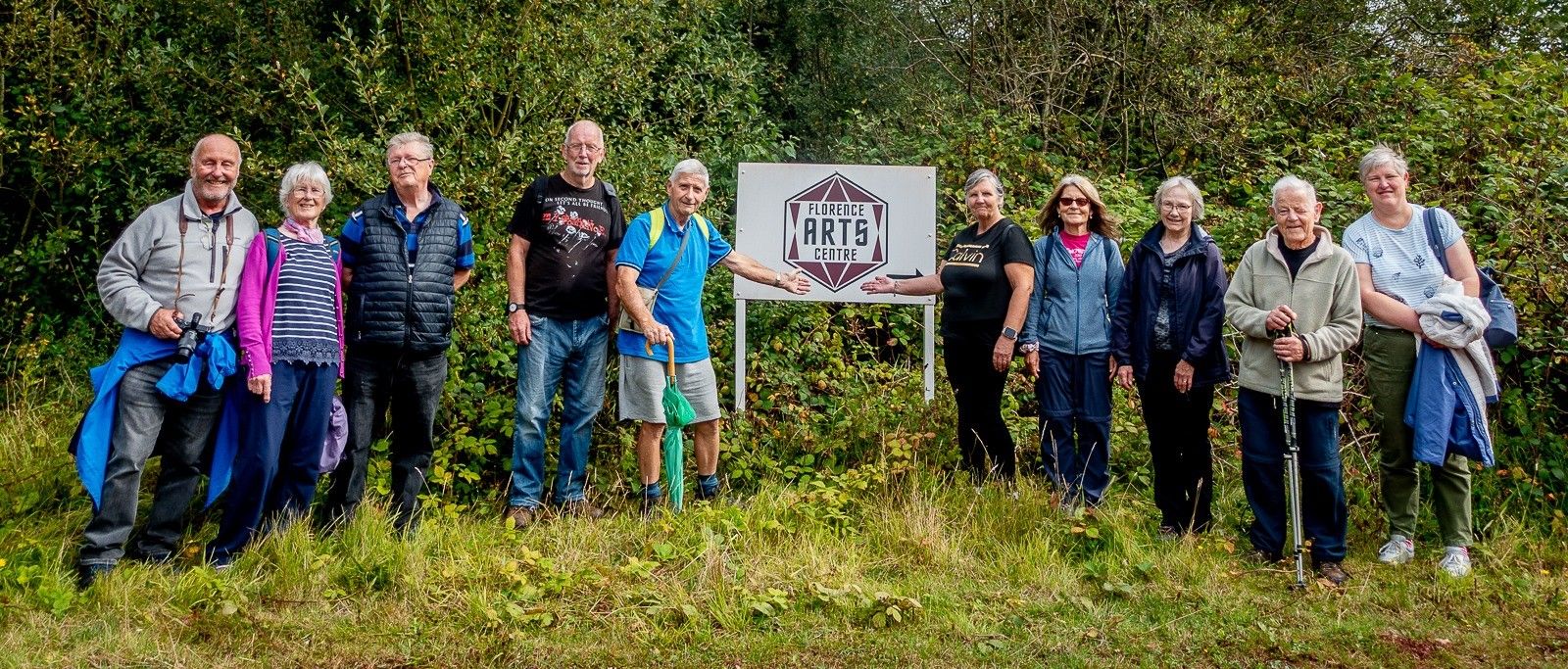 Walking group at Florence Arts Centre sign